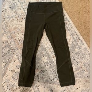 Green cropped lululemon leggings with pockets